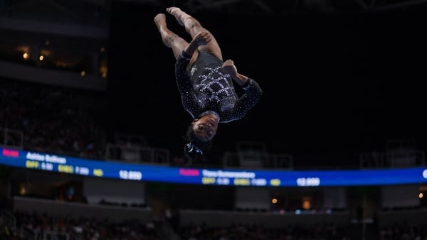 Simone Biles competing in the floor exercise
