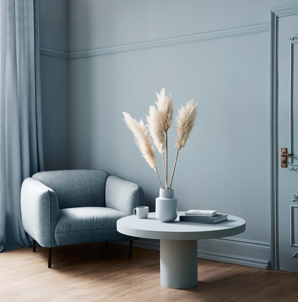 Chair and table in colour drenched room (Graham & Brown/PA)
