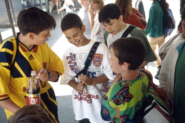 Teenage secondary school boys in playground