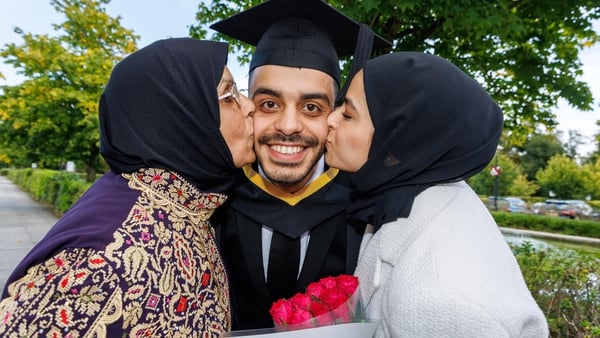Saleem Yateem is congratulated by his mother and fiancee at the degree ceremony at UL (Pic: Arthur Ellis/UL)