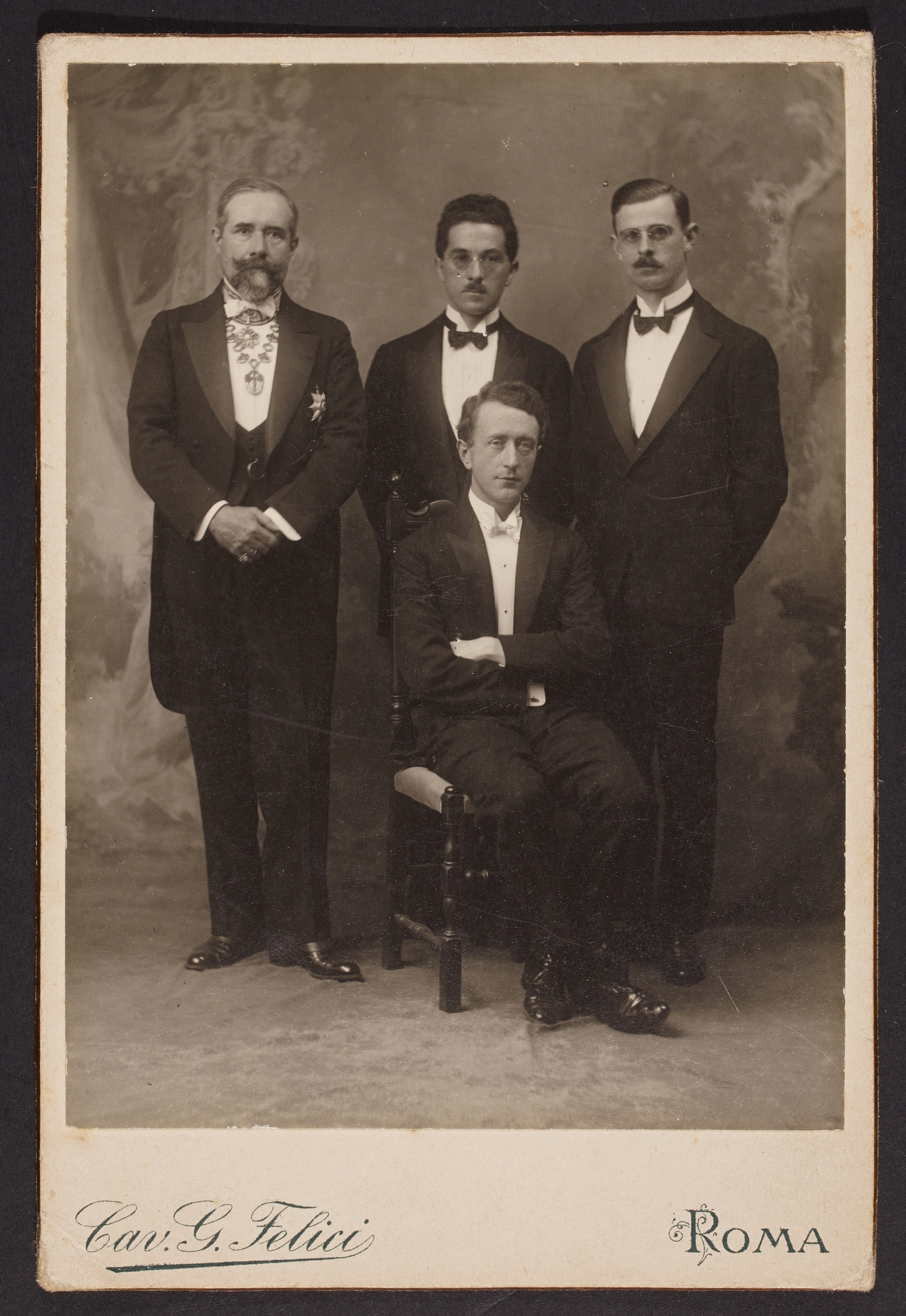 Image - The new Minister for External Affairs Desmond FitzGerald and his core Dublin team, Joseph P Walshe (centre) and Sean Murphy (right) alongside the Marquis MacSwiney (Credit: National Library of Ireland. Kathleen McKenna-Napoli photographic collection)
