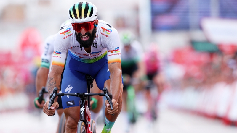 Cyclist Geoffrey Soupe sprinting across the line at La Vuelta a Espania. His bears is resplendent and his thigh muscles are SWOLE