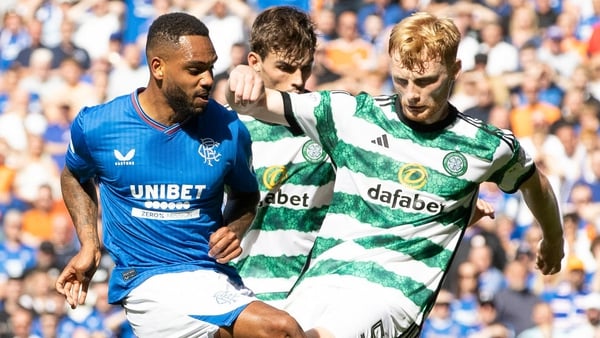 Liams Scales (R) charges down Rangers' Danilo