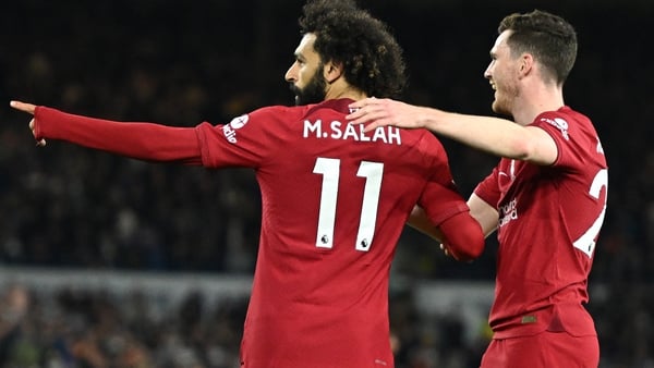Liverpool team-mates Mohamed Salah (L) and Andy Robertson