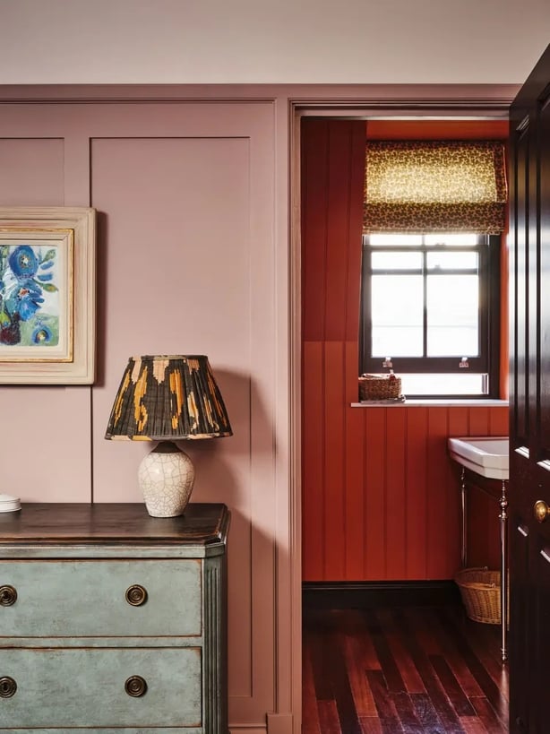 This loft bedroom looks through to the ensuite bathroom and Gough says you can see how the mood board has been continued (Simon Bevan/PA)