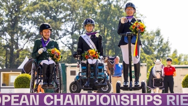 (L-R) Silver medal winner Michael Murphy (IRL), gold medal winner Sara Morganti (ITA) and bronze medal winner Martina Benzinger (GER) share the podium