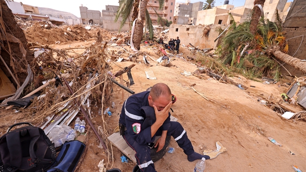 A member of the Algerian Rescue Team reacts as he assists in relief work in Libya's eastern port city of Derna