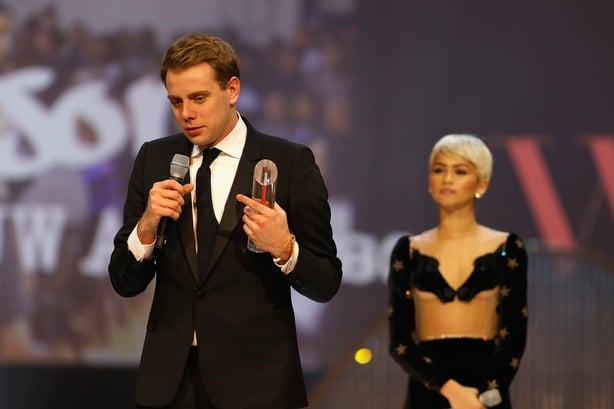  Jonathan Anderson (L), winner of the British Designer of the Year Womenswear award, and Zendaya (R) on stage during The Fashion Awards 2017 
