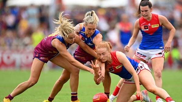 Blaithin Mackin (c) of the Demons and the Lions' Orla O'Dwyer (2nd left) are part of the growing Irish contingent plying their trade in the AFLW
