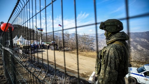A Russian peacekeeper guards the Lachin corridor, the Armenian-populated breakaway Nagorno-Karabakh region's only land link with Armenia