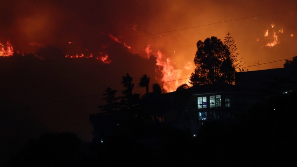 Wildfires spread through residential houses in Sicily