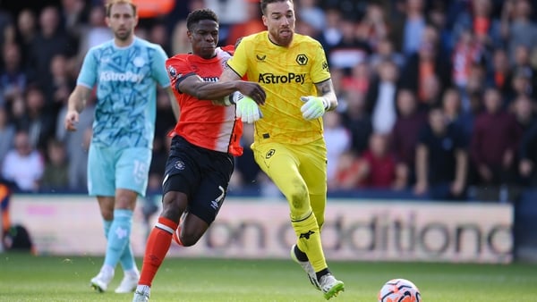 Chiedozie Ogbene battles for possession with Wolves goalkeeper Jose Sa