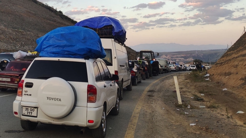 Armenians fleeing Nagorno-Karabakh sit in a long traffic queue