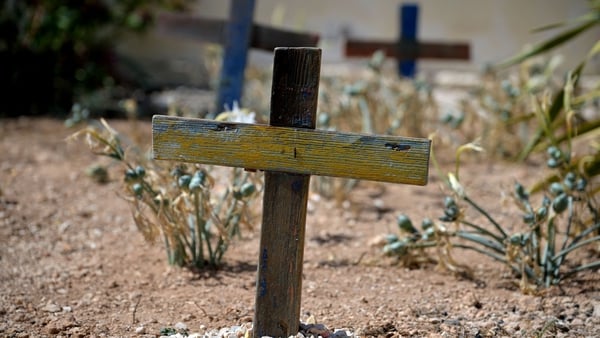 Wooden crosses made with the remains of boats used by migrants to cross the Mediterranean in a cemetery on Lampedusa