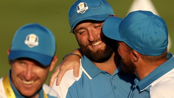 Jon Rahm is congratulated by European team-mate Shane Lowry after the Friday afternoon fourball matches