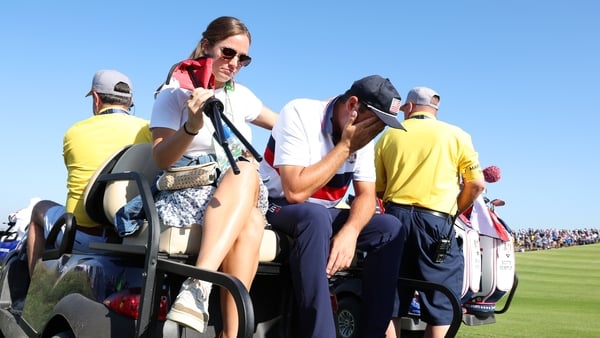 Scottie Scheffler reacts after the bruising 9&7 defeat alongside Brooks Koepka to Viktor Hovland and Ludvig Aberg