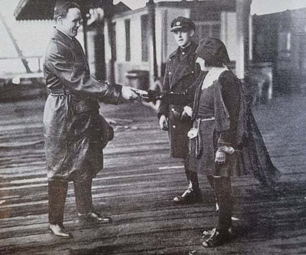 McTigue, when he arrived in Dublin from America for world title fight he won, was presented with a lucky box of shamrocks by a youthful admirer (Image: Irish Life, March 1923)