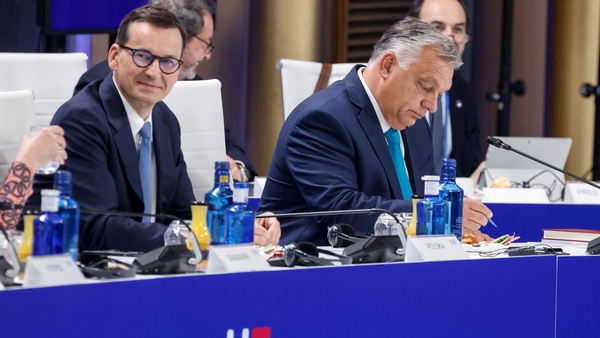 Hungary's Prime Minister Viktor Orban (R) and Poland's Prime Minister Mateusz Morawiecki during the summit in Granada