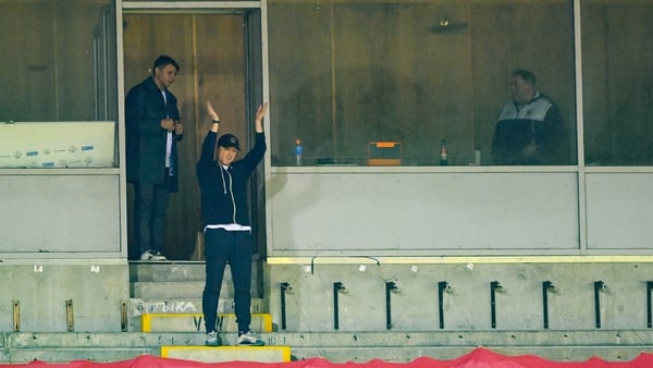 Suspended Shelbourne manager Damien Duff applauds his players from the stand