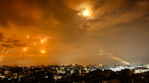 Rockets fired by Palestinian militants from Gaza City are intercepted by the Israeli Iron Dome defence missile system