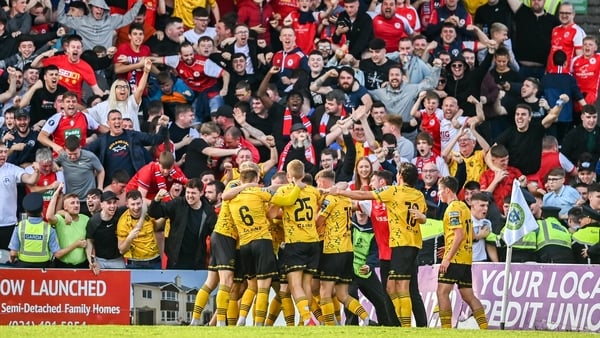 St Patrick's Athletic players celebrate in front of their vocal travelling support