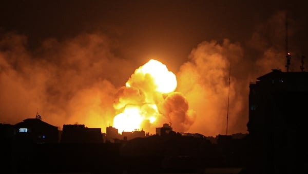 Fire and smoke rise above buildings in Gaza City during an Israeli air strike