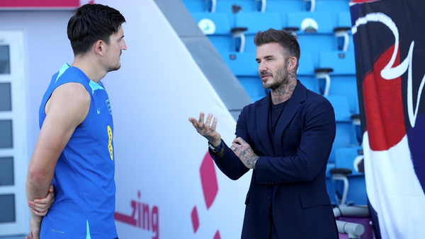 David Beckham talks to Harry Maguire during England's 2022 World Cup campaign in Qatar