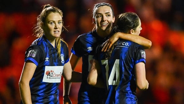 Athlone Town's Róisín Molloy celebrates with team-mates Dana Scheriff, left, and Chloe Singleton after scoring their side's fourth goal