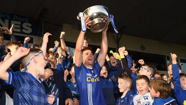 Scotstown captain Damien McArdle lifts the cup