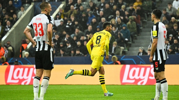 Borussia Dortmund's Felix Nmecha wheels away after his first-half goal against Newcastle United