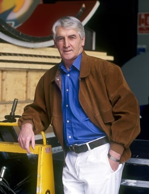 Jim Bartley standing among props and scenery in RTÉ studios, 2003