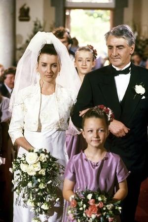 Kira Carroll as Helen and Jim Bartley as Bela, pictured in a scene featuring the wedding of Helen Doyle, 1997