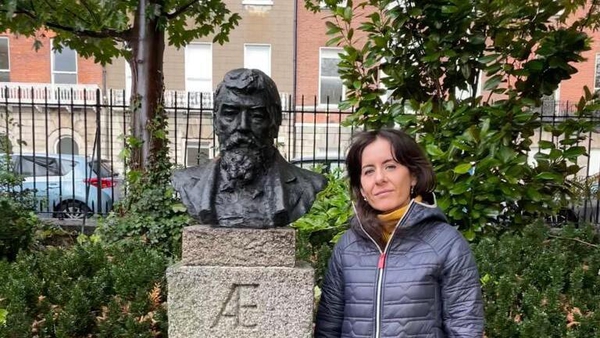Organiser Marianne McGee with a bust of AE Russell in Merrion Square, Dublin