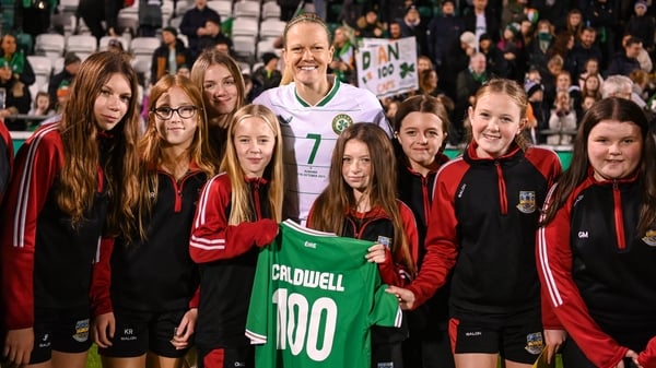 Diane Caldwell poses with members of her hometown club Balbriggan FC