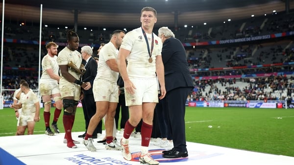 England's Owen Farrell looks on after receiving his bronze medal