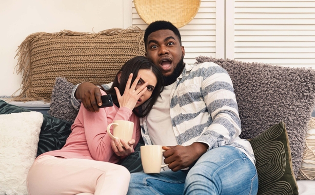A couple watching a horror movie