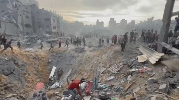 Palestinians looking for survivors following an Israeli stike on a refugee camp in Jabalia on the northern Gaza Strip