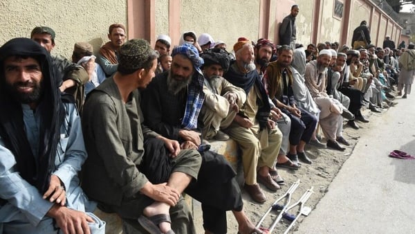 Undocumented Afghans wait for paperwork at the Afghan Consulate in the Pakistani city of Quetta