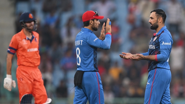 Mohammed Nabi (right) celebrates a Dutch wicket in Afghanistan's win