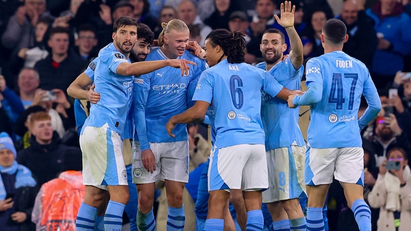 Manchester City players celebrate Erling Haaland's second goal on the night