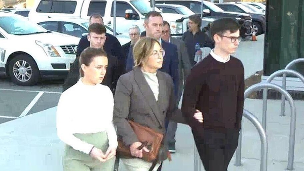 Jason Corbett's family, including his two children, outside the US court