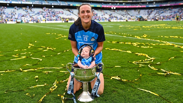 Hannah Tyrrell celebrating her All-Ireland success with 7-week old daughter Aoife
