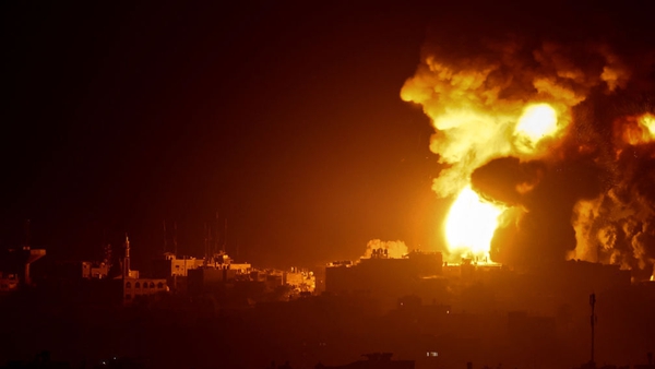 A fireball erupts in Gaza during an Israeli bombardment