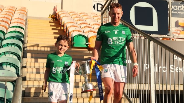 Ryan Bogue and his nephew Callum with the AHL Division 3B title in 2022 - but Fermanagh's involvement in the league from 2025 is in jeopardy