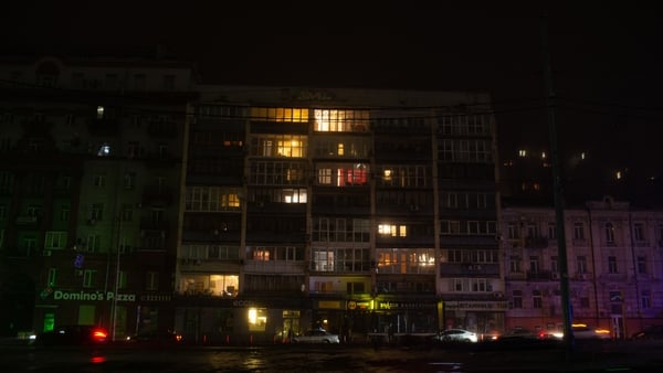 An apartment block last November in Kyiv, with lights powered by a generator