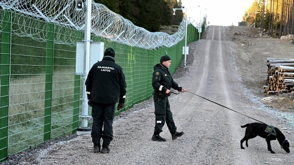 Members of the Finnish Border Guard at a section of a pilot border fence at the Finnish-Russian border in Imatra (File image)
