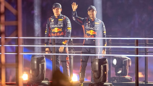 Verstappen (l) and team-mate Sergio Perez were introduced to the crowd atop a platform during the opening ceremony