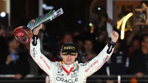 Max Verstappen celebrates on the podium after winning the Las Vegas Grand Prix