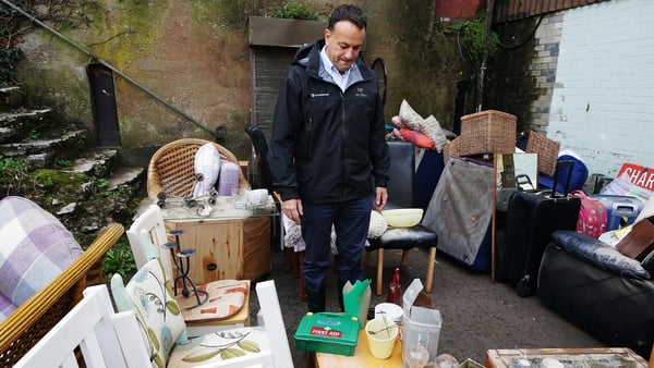 Taoiseach Leo Varadkar observes the damage to a charity shop on Main Street in Midleton, Co Cork, after Storm Babet last month