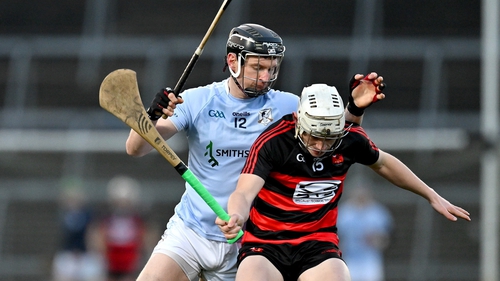 Mikey Mahony gets to the ball ahead of Na Piarsaigh's Kevin Downes
